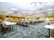 Spacious meeting room with tables, chairs, and neutral decor, providing a versatile event space at 1828 Foxhunt Dr # A, Sun City Center, FL 33573