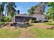 A home's backyard features a screened pool and lanai adding an inviting outdoor living space at 1905 Horseshoe Dr, Plant City, FL 33566
