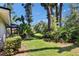 Backyard displaying the screened pool area, integrated with the lush landscaping for a serene outdoor experience at 1905 Horseshoe Dr, Plant City, FL 33566