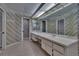 Bathroom with double sinks, vanity, mirrors and stand up showers at 1905 Horseshoe Dr, Plant City, FL 33566