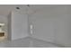 Bright room with tile flooring, ceiling fan, and view into bathroom at 1905 Horseshoe Dr, Plant City, FL 33566