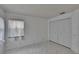 Bedroom features a closet, window and bright, natural light with tile floors at 1905 Horseshoe Dr, Plant City, FL 33566