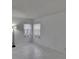 Bedroom features a floor lamp, two windows and bright, natural light at 1905 Horseshoe Dr, Plant City, FL 33566
