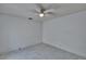 Bedroom features a ceiling fan and bright, natural light with tile floors at 1905 Horseshoe Dr, Plant City, FL 33566