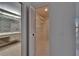 Walk-in closet with shelves and rod and view into bathroom at 1905 Horseshoe Dr, Plant City, FL 33566