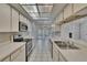 Bright kitchen with stainless steel appliances and plenty of counter space for meal prep at 1905 Horseshoe Dr, Plant City, FL 33566
