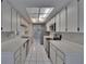 Bright kitchen features white cabinetry, tile floors, and stainless steel appliances at 1905 Horseshoe Dr, Plant City, FL 33566