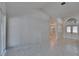 Spacious living room featuring tile floors, neutral walls, recessed lighting, and entryway with double doors at 1905 Horseshoe Dr, Plant City, FL 33566
