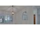 Living room with a hanging light fixture and white walls for a bright, airy feel at 1905 Horseshoe Dr, Plant City, FL 33566