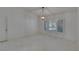Bright, spacious living room with marble floors and plantation shutters for natural light at 1905 Horseshoe Dr, Plant City, FL 33566