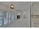 Bright living room with fireplace, tile floors, and sliding glass doors at 1905 Horseshoe Dr, Plant City, FL 33566
