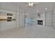 Open-concept living area with fireplace, tile flooring, and natural light at 1905 Horseshoe Dr, Plant City, FL 33566