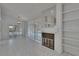 Living area with fireplace, and tile flooring, overlooking outdoor space at 1905 Horseshoe Dr, Plant City, FL 33566