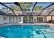 Sparkling in-ground pool with screened enclosure and patio access at 1905 Horseshoe Dr, Plant City, FL 33566