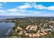 Beautiful aerial view of waterfront homes, marina, and bay under sunny skies and scattered clouds at 191 Banyan Bay Dr, St Petersburg, FL 33705