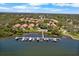 Stunning aerial view of waterfront homes with private boat docks and lush landscaping at 191 Banyan Bay Dr, St Petersburg, FL 33705