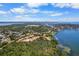 Panoramic aerial view of waterfront homes, canals, and cityscape under a sunny, cloudy sky at 191 Banyan Bay Dr, St Petersburg, FL 33705