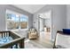 Serene Bedroom with hardwood floors and an adjacent office space, bathed in natural light from large windows at 191 Banyan Bay Dr, St Petersburg, FL 33705