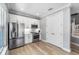 Well-lit kitchen featuring stainless steel appliances, white cabinets, and modern finishes at 191 Banyan Bay Dr, St Petersburg, FL 33705