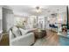 Comfortable living room with hardwood floors, a plush sofa, an elegant coffee table, and stairs to the second floor at 191 Banyan Bay Dr, St Petersburg, FL 33705