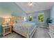 Coastal themed bedroom with beautiful natural light and light wood floors at 191 Banyan Bay Dr, St Petersburg, FL 33705