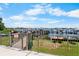 Fenced in view of private marina and boardwalk, with boats docked and kayaks stored for tenants at 191 Banyan Bay Dr, St Petersburg, FL 33705