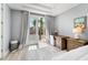 Bright office nook with hardwood floors, offering a serene space for work with views of the balcony at 191 Banyan Bay Dr, St Petersburg, FL 33705