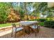Charming patio with brick pavers, featuring a dining table for outdoor meals and gatherings at 191 Banyan Bay Dr, St Petersburg, FL 33705