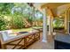Relaxing covered patio with a cozy fire pit and comfortable seating area for entertaining at 191 Banyan Bay Dr, St Petersburg, FL 33705