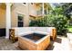 Relaxing patio with a modern fire pit and spacious cushioned seating area, ideal for socializing at 191 Banyan Bay Dr, St Petersburg, FL 33705