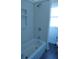 Bathroom featuring a shower/tub combo, new fixtures, and a window at 1924 30Th S St, St Petersburg, FL 33712