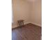 Bedroom featuring a small wooden table, wood floors, neutral paint and one window at 1924 30Th S St, St Petersburg, FL 33712
