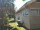 Home featuring neutral color, window, and minimal landscaping at 1924 30Th S St, St Petersburg, FL 33712