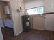 Bright kitchen features modern flooring and white cabinets offering functionality and style at 1924 30Th S St, St Petersburg, FL 33712