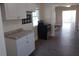 Traditional kitchen featuring white cabinets, stainless steel oven and light countertops at 1924 30Th S St, St Petersburg, FL 33712