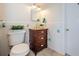 The bathroom features decorative tile, a vanity with drawers, and a ceramic tile floor at 1926 Fairway W Cir, Dunedin, FL 34698