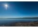 Calm waterfront view of Dunedin showcasing the beautiful serene water and soft sandy shoreline at 1926 Fairway W Cir, Dunedin, FL 34698