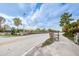 Scenic entry to Honeymoon Island State Park with barrier and clear roadway at 1926 Fairway W Cir, Dunedin, FL 34698