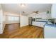 Bright kitchen featuring white cabinets, stainless steel appliances, and wood flooring at 1926 Fairway W Cir, Dunedin, FL 34698