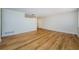 Spacious living room features wood floors and great light perfect for relaxing and entertaining at 1926 Fairway W Cir, Dunedin, FL 34698