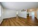 Spacious living room featuring wood floors and great light perfect for relaxing and entertaining at 1926 Fairway W Cir, Dunedin, FL 34698