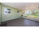 The patio offers a view of the surrounding yard with the outdoor hose at 1926 Fairway W Cir, Dunedin, FL 34698