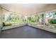 A screened patio offers an outdoor space for relaxation and entertainment at 1926 Fairway W Cir, Dunedin, FL 34698
