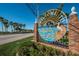 Charming Dunedin Causeway sign featuring a pelican, palm trees, and beautiful water views at 1926 Fairway W Cir, Dunedin, FL 34698