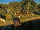Scenic park showcasing a wooden dock, lakeside picnic spots, and lush landscaping at 204 Lake Charles Ct, Oldsmar, FL 34677