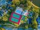 A planned community features tennis and basketball courts, a swimming pool, and a hot tub at 204 Lake Charles Ct, Oldsmar, FL 34677
