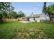 A sprawling backyard offers plenty of space for activities and landscaping possibilities at 204 Lake Charles Ct, Oldsmar, FL 34677
