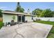 The backyard features a spacious patio perfect for outdoor relaxation and entertaining at 204 Lake Charles Ct, Oldsmar, FL 34677