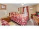 Cozy bedroom with ceiling fan, natural light and neutral paint at 204 Lake Charles Ct, Oldsmar, FL 34677