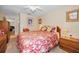 Comfortable bedroom featuring carpet and ceiling fan at 204 Lake Charles Ct, Oldsmar, FL 34677